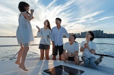 Happy family enjoying fun time by the marina in Bodrum – yacht vacation moment with Bodrum yacht charter services